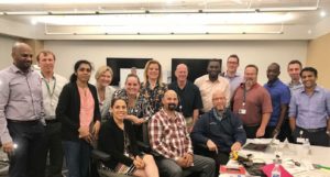 Claranne stands in a group during the LeapFrog Training Program.