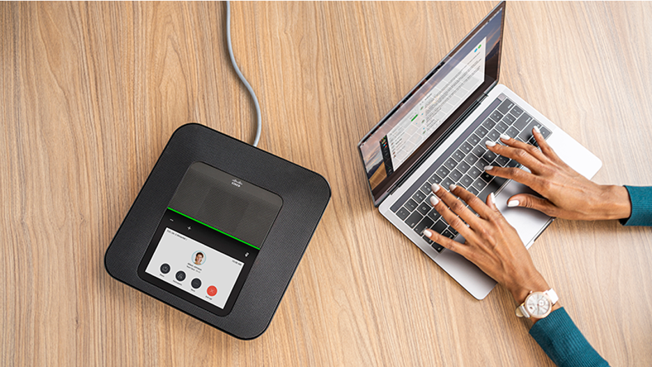 Woman using Webex Room Phone