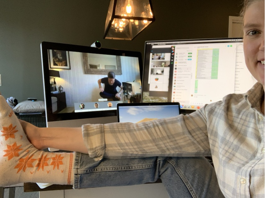 Anna participates in a virutal yoga session via Webex.