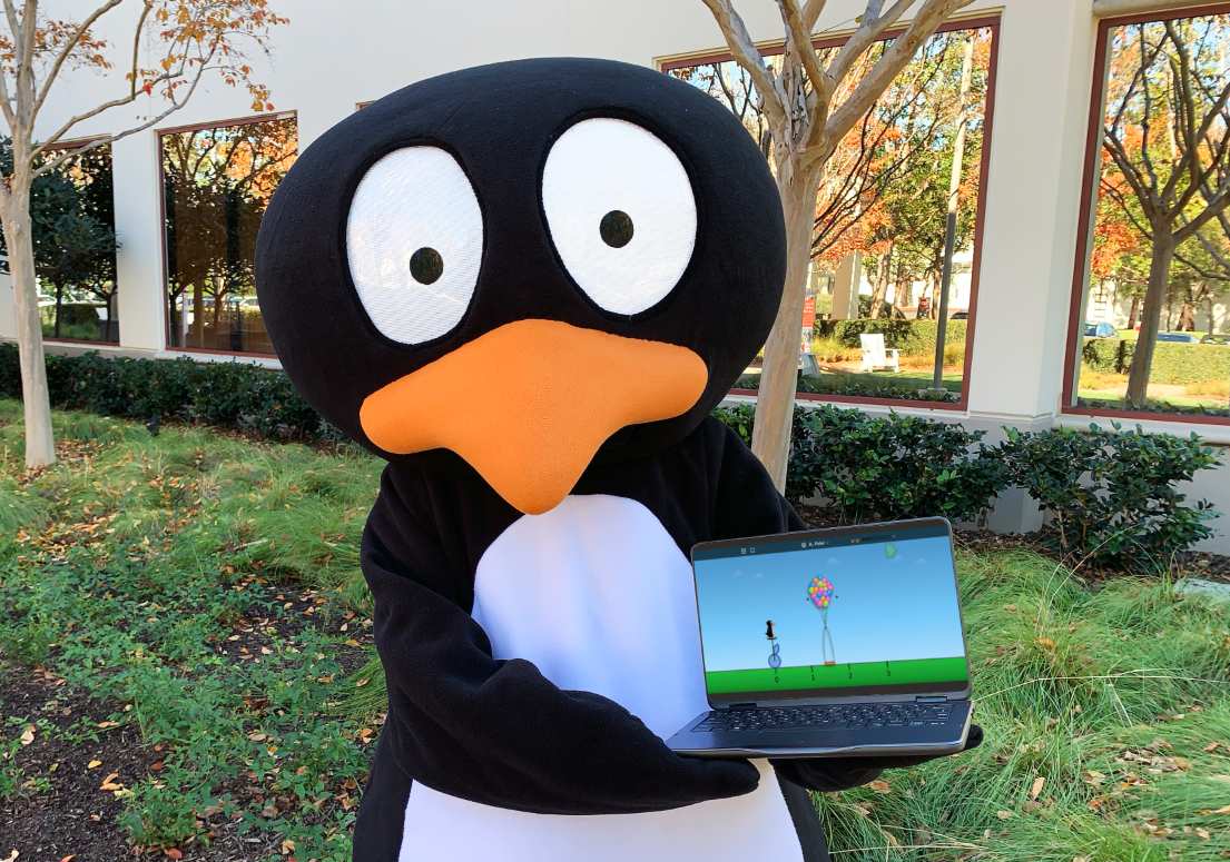 JiJi, ST Math's mascot, holding a laptop