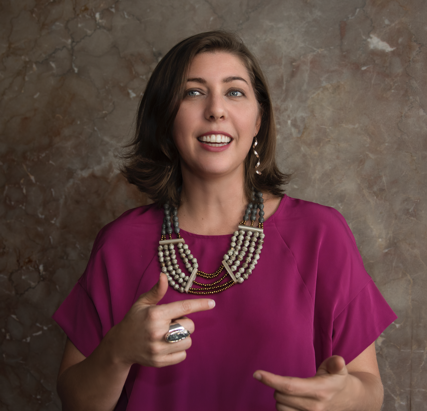 A professional headshot of Annie