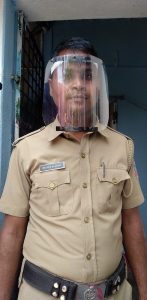 A police officer wearing one of Vispala's 3D printed face shields