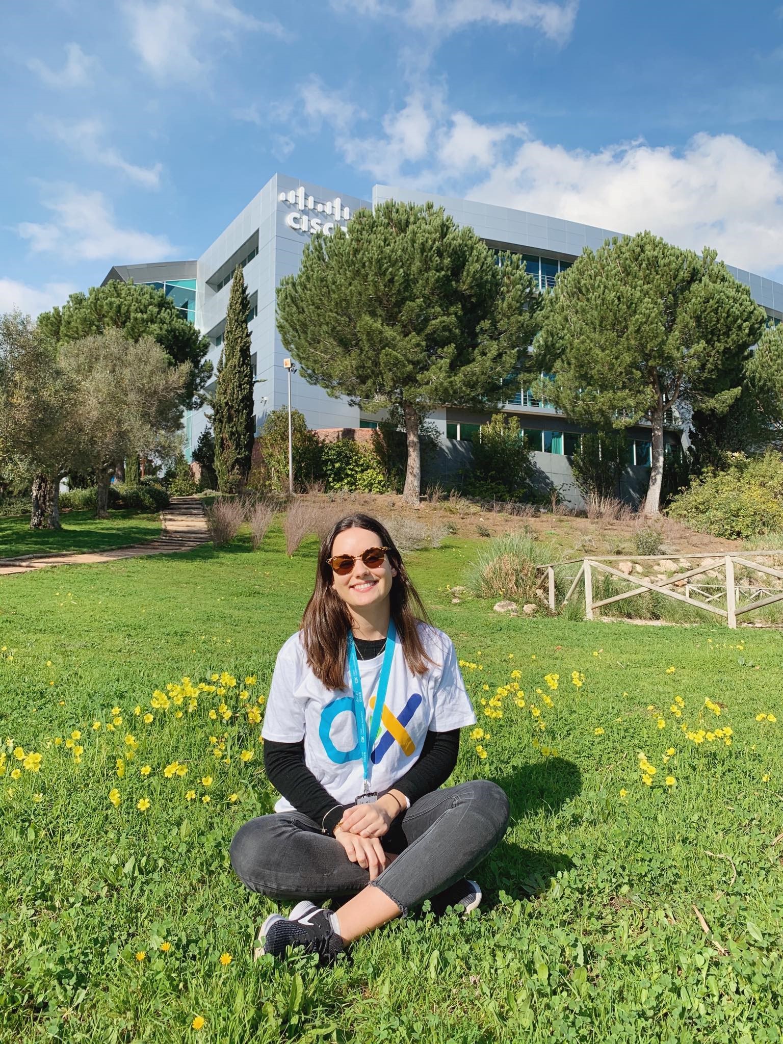 Francisca sits in front of the Cisco Lisbon office