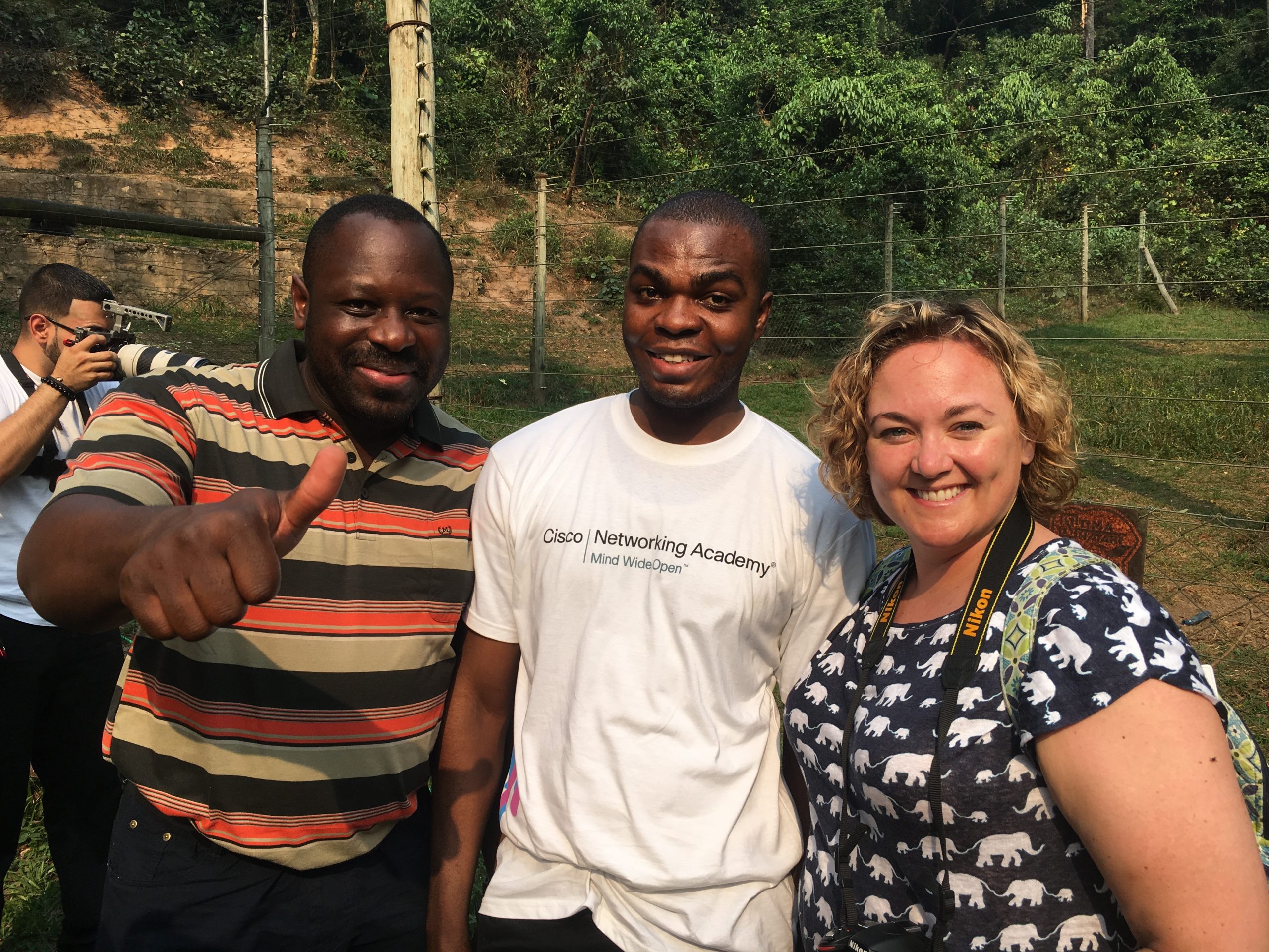 Shawn and her peer Calvain Nangue smiling with one of the Network Academy students in the Congo.