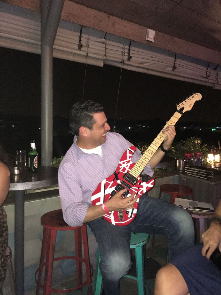 Joey playing electric guitar.