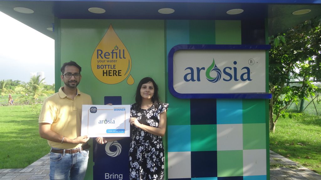 Co-founders of Hydrotec Solutions with their water kiosk