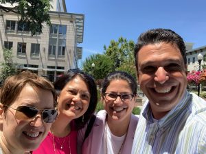 Joey selfie with fellow employees.