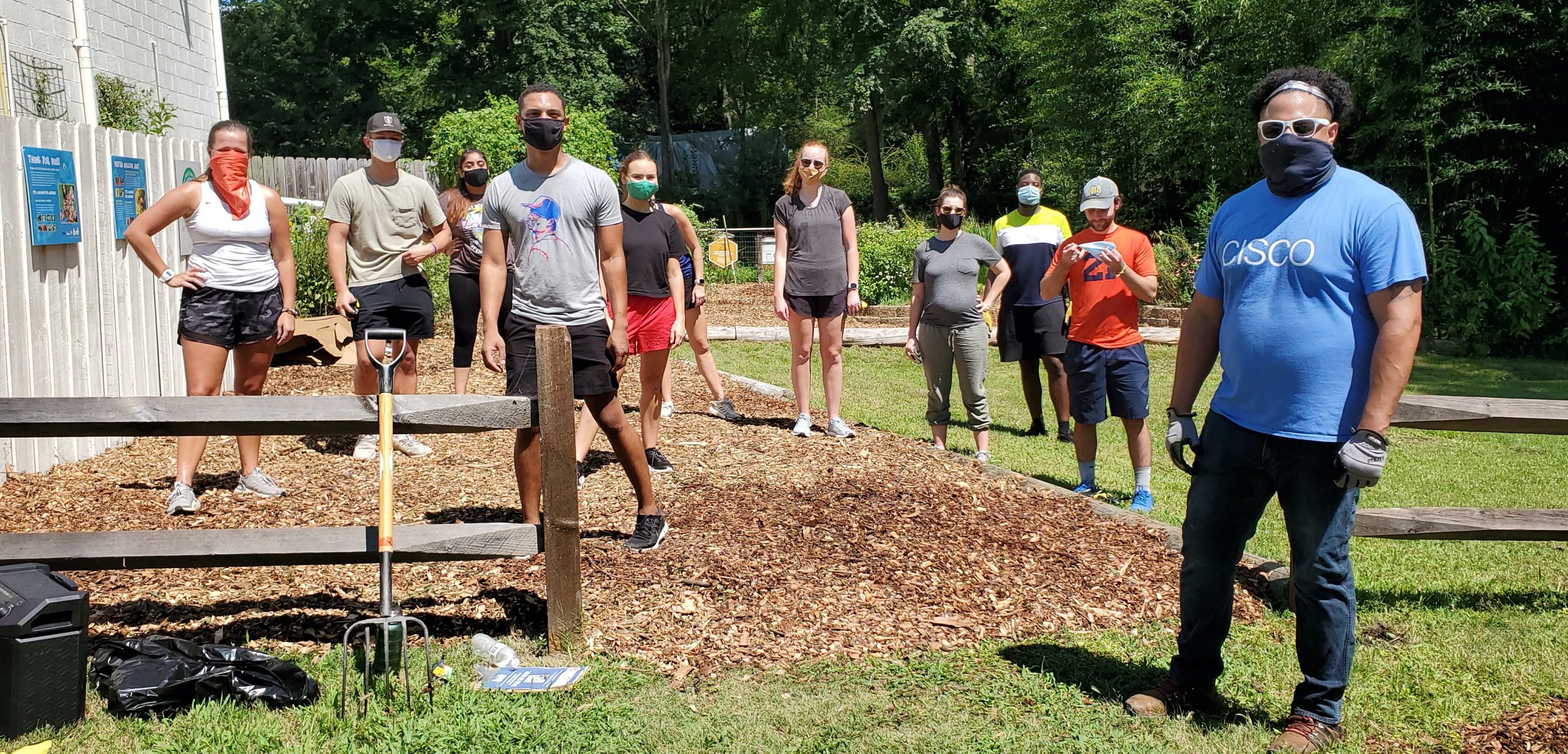 Juan's team gives back while remaining socially distant and wearing masks.