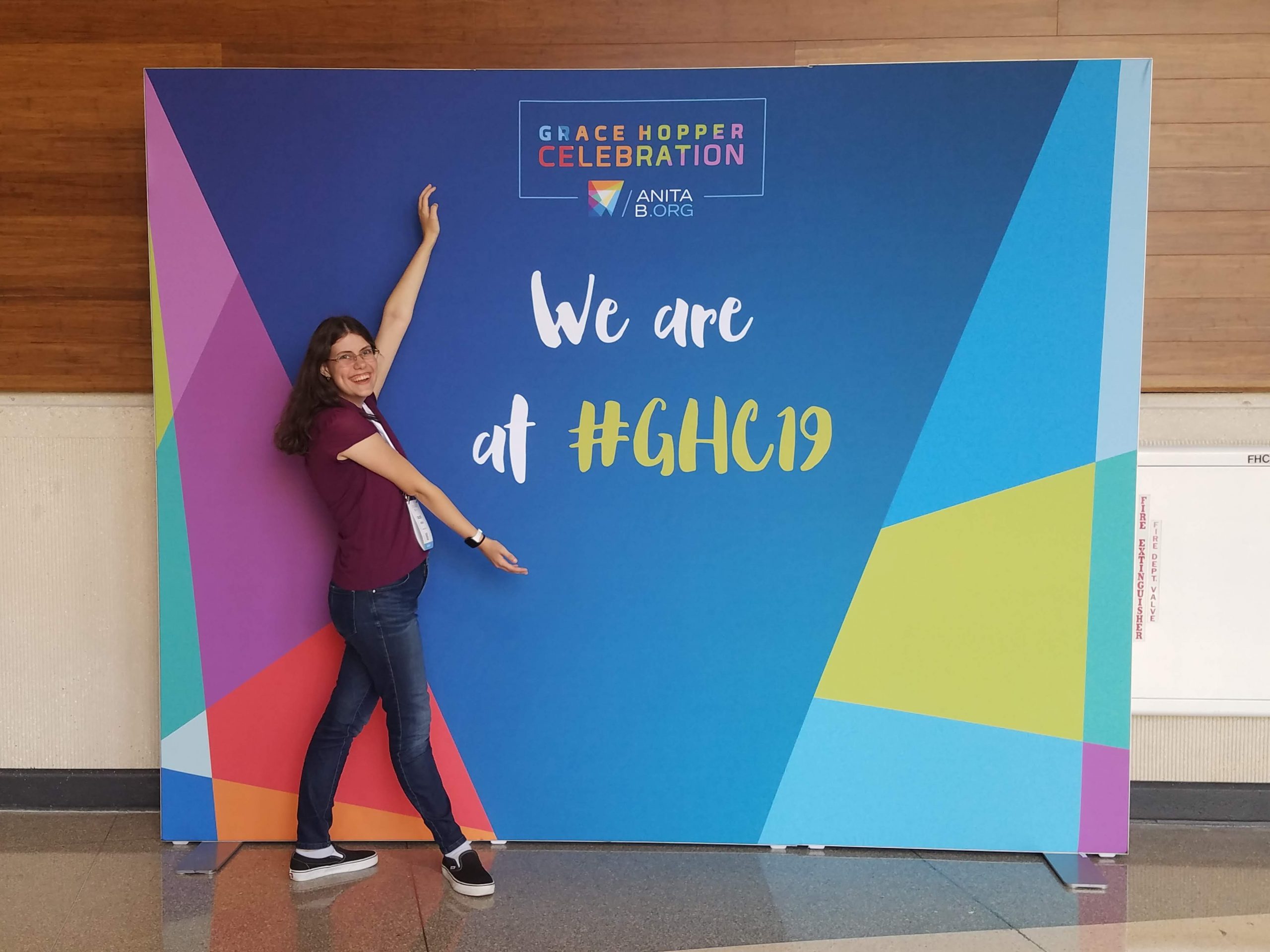 Chloe in front of Grace Hopper sign.