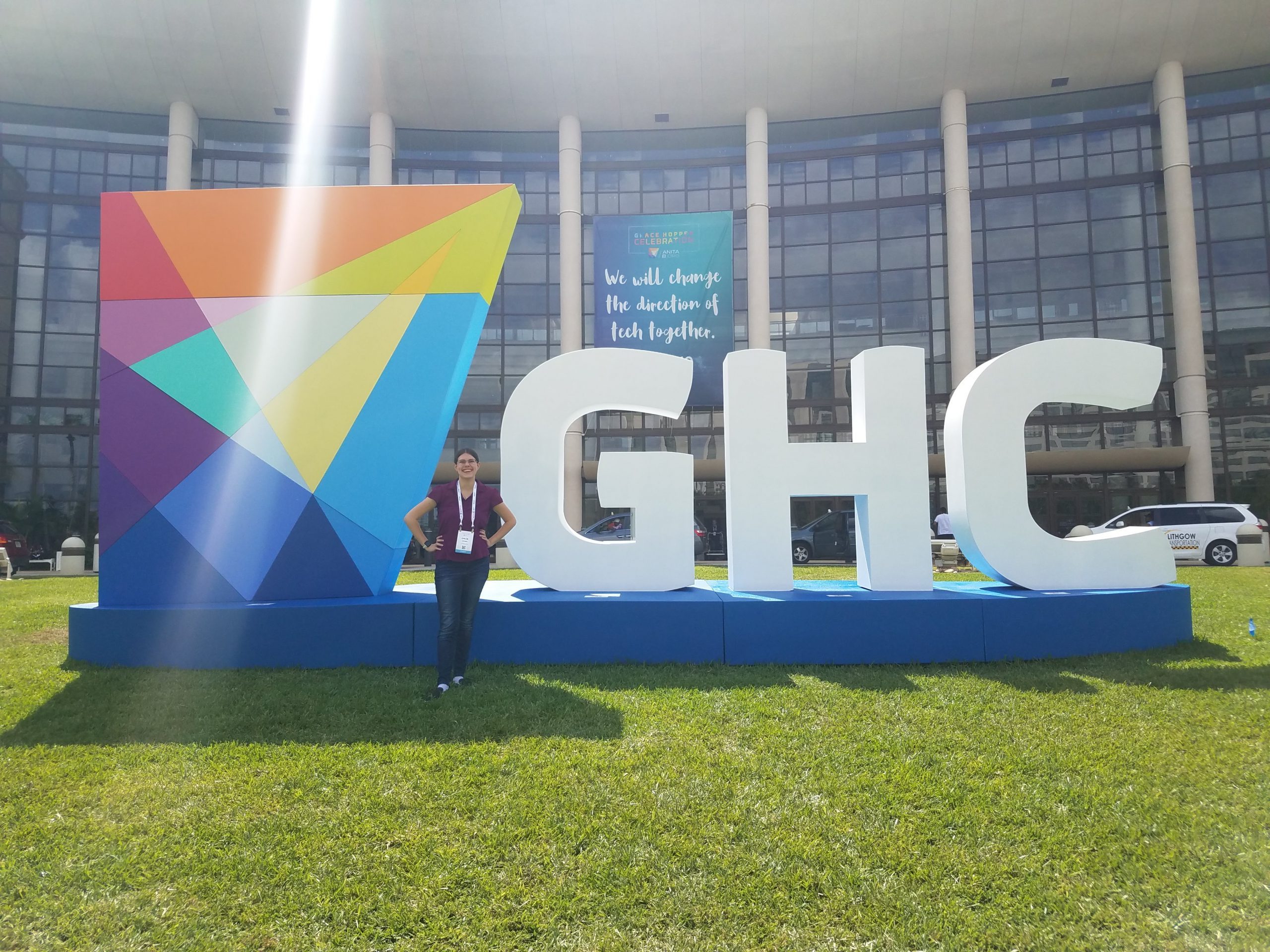 Chloe in front of the GHC sign.