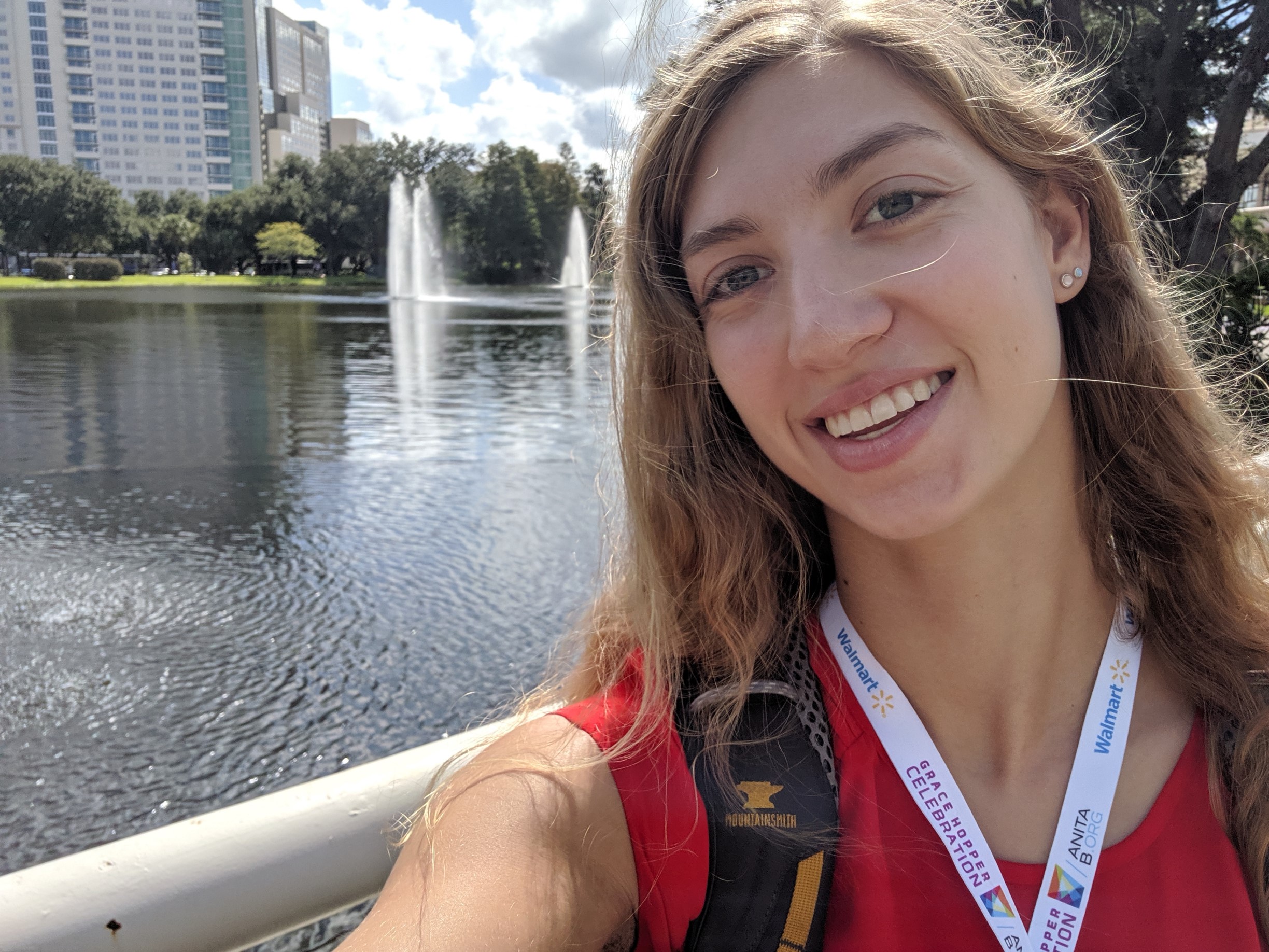 Olivia in front of a fountain in Orlando, FL.