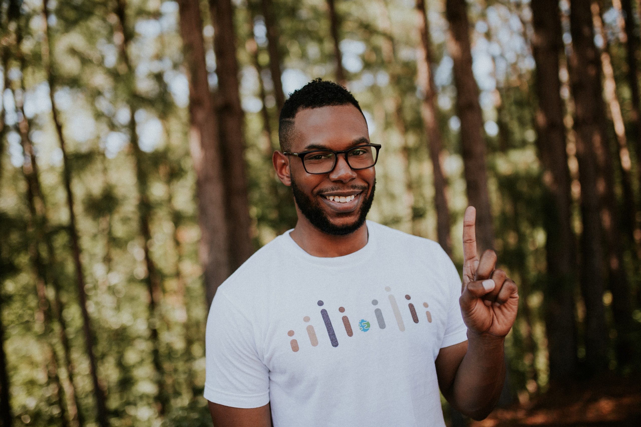 Chris wears a Cisco shirt and holds up his finger as #1.