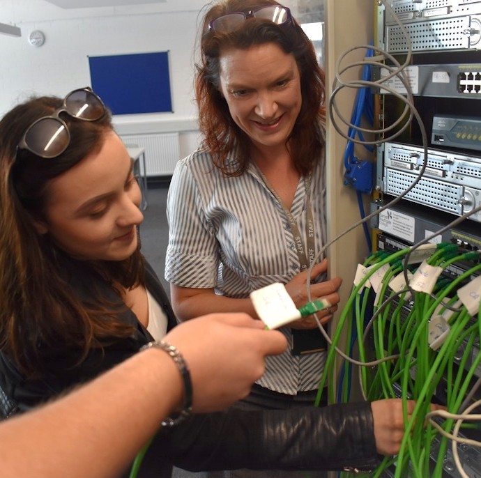 Rebecca Harrop teaching hands-on IT skills. Photo credit: Mark Phillips