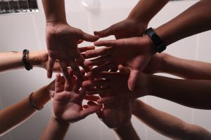 Hands coming togther as a team