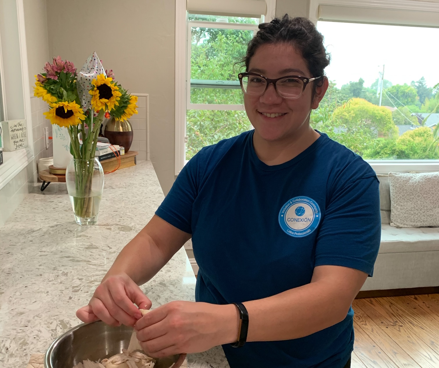 Lauren in Conexion shirt making posole. 