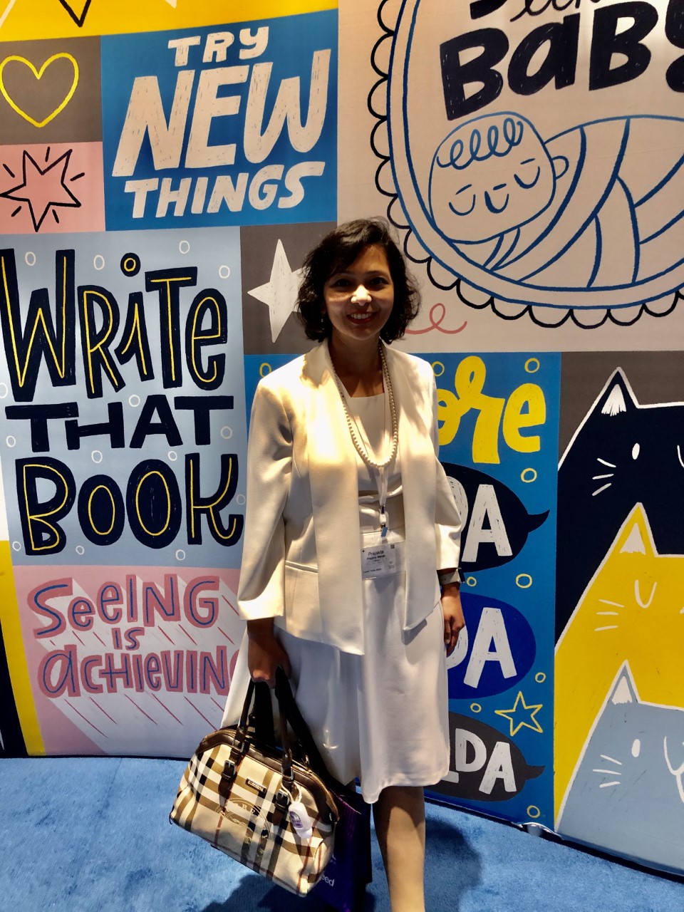 Prajakta in front of sign. 