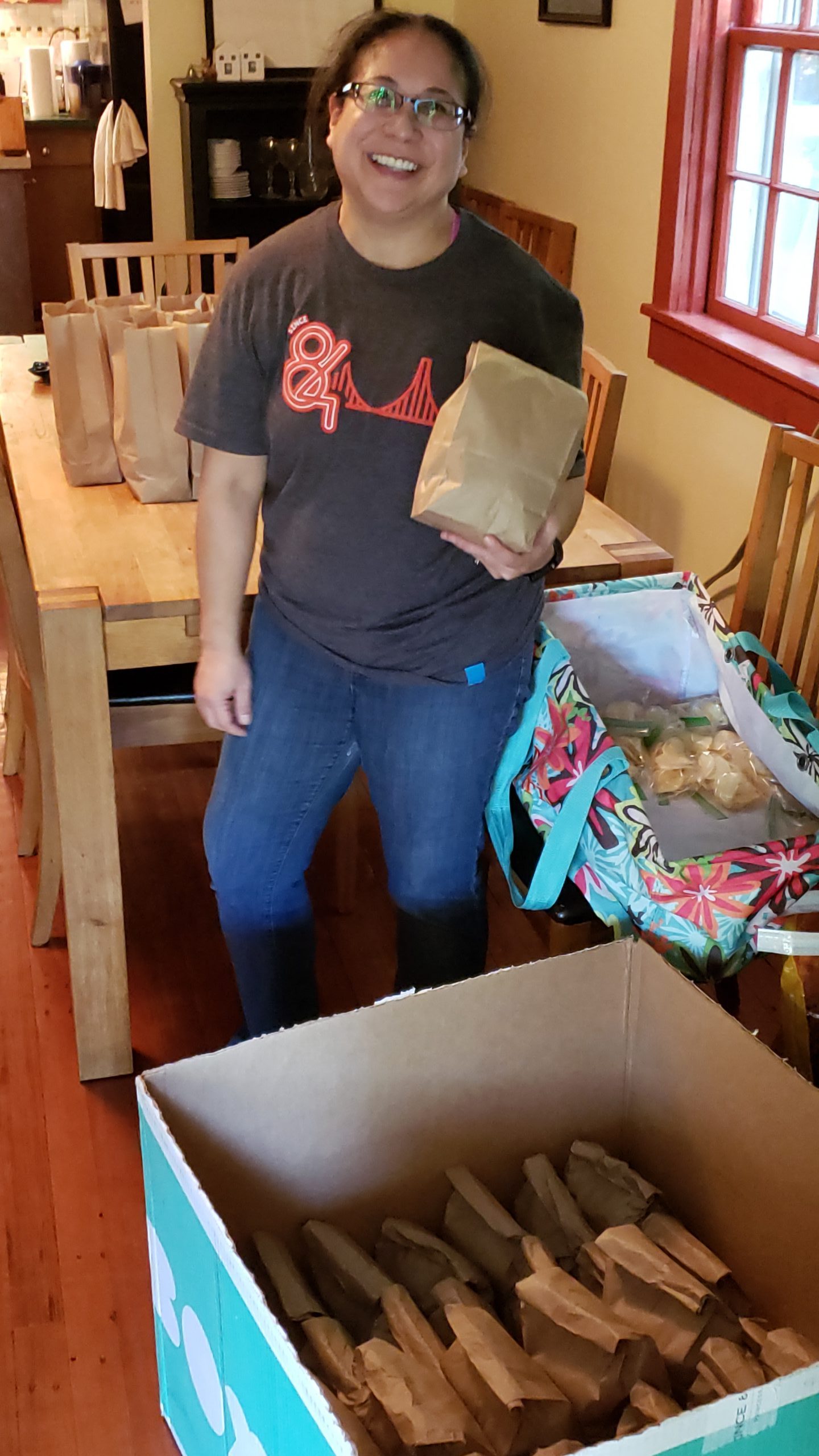 Maria bagging sandwiches.