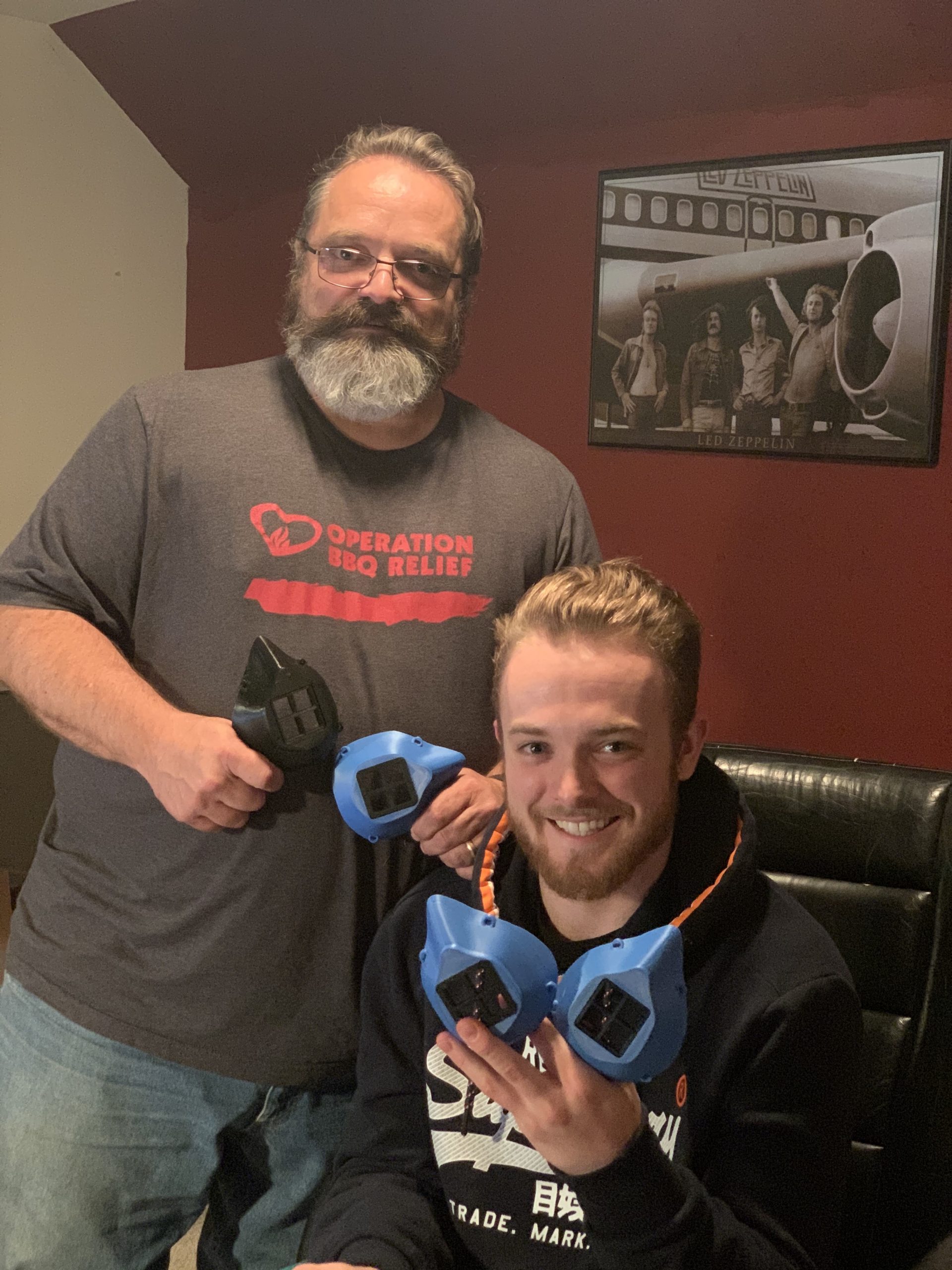 Nathan and his dad with 3D printed masks.