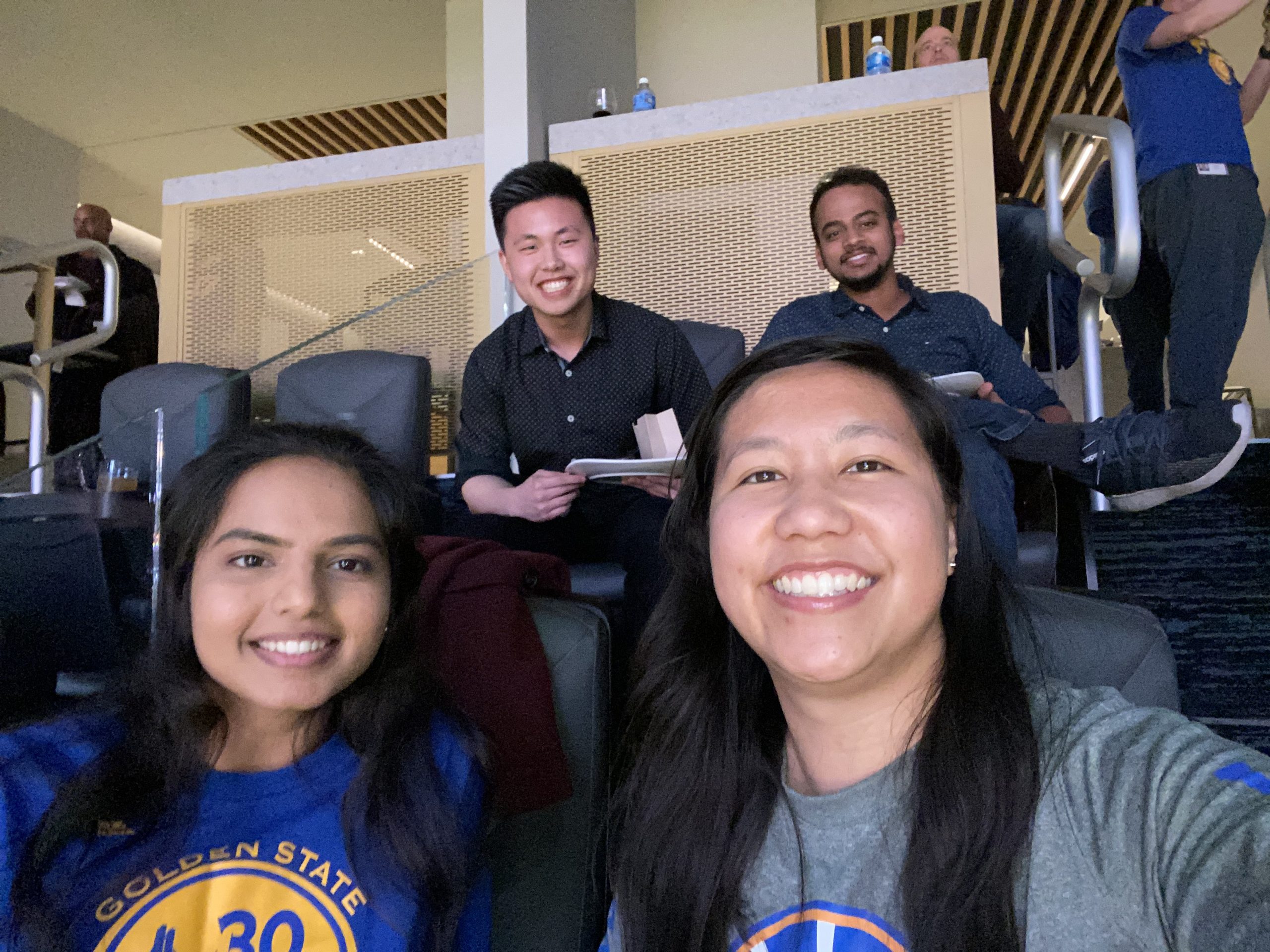 Selfie of four Cisco employees attending a Warriors basketball game.