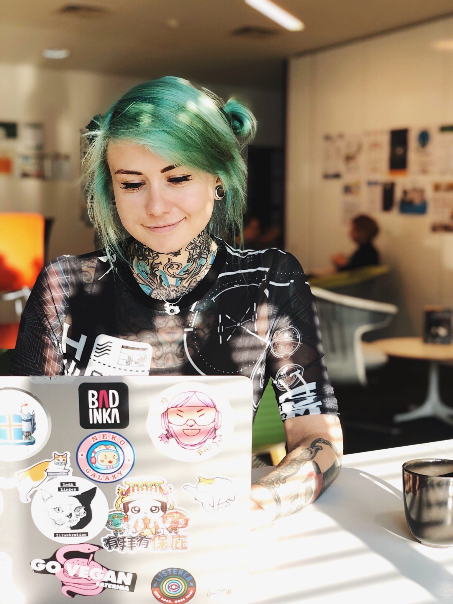 Cisco employee behind laptop