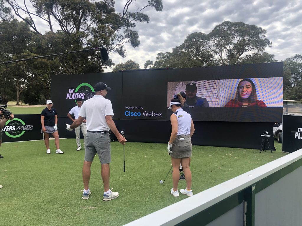 tournament juniors being mentored by PGA professional athletes and using Cisco Webex on a green field