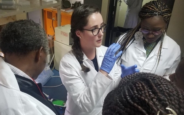 CEO of OmniVis talking to other people in a lab