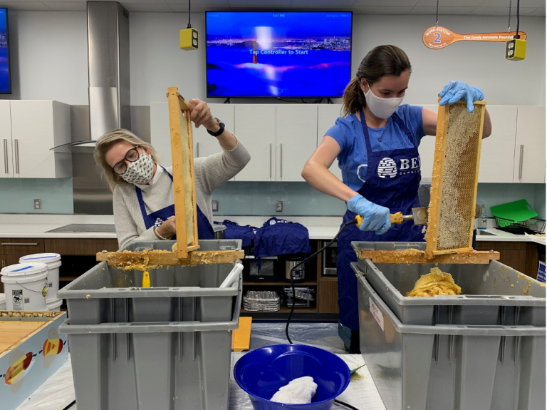 Cisco employees helping with the honey harvest