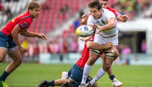 A German team of men play football on a field