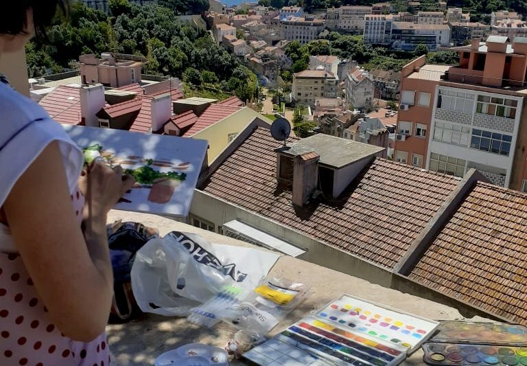 Alena painting Krakow buildings