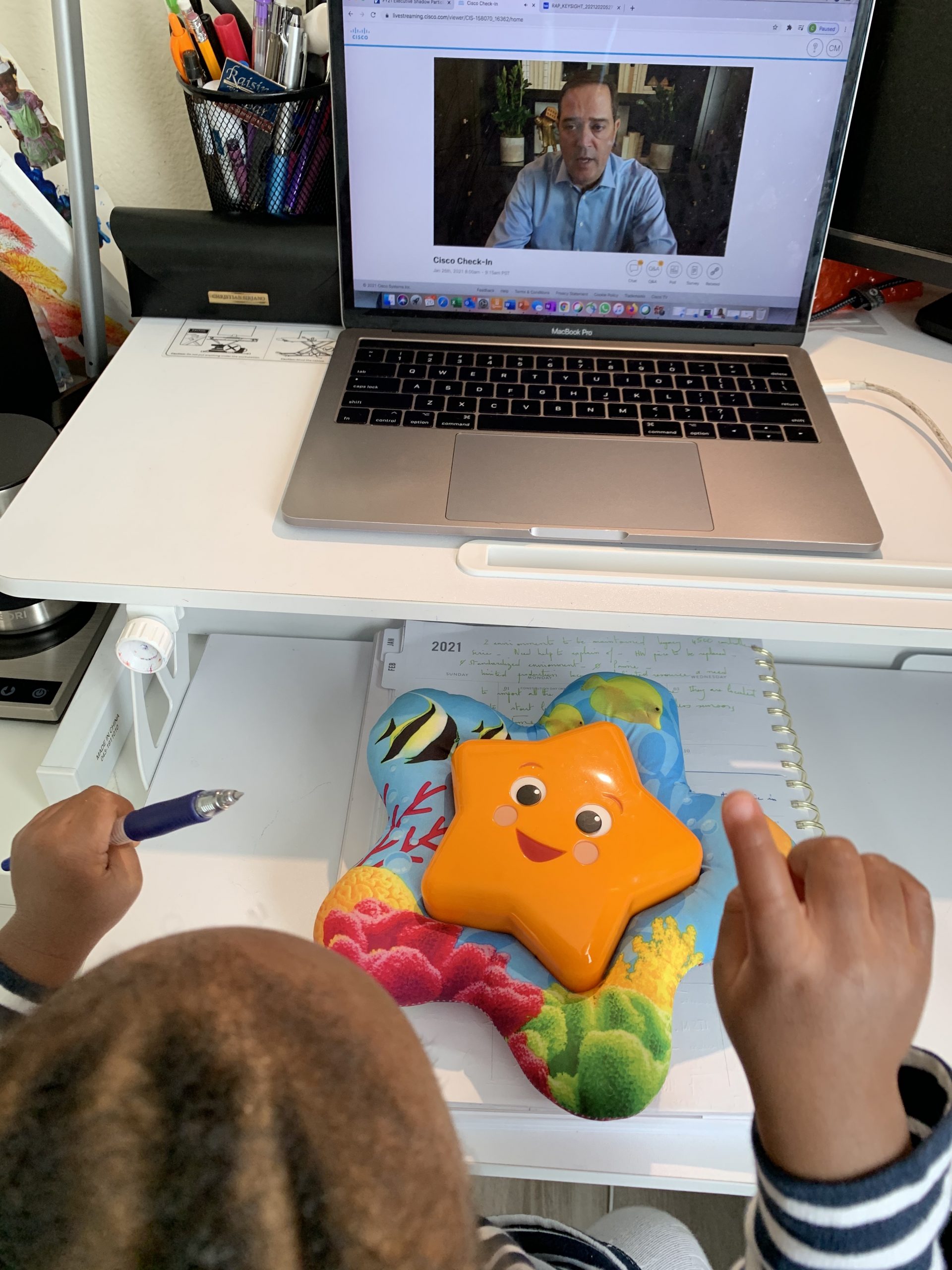 Christelle's son watching Chuck Robbins present.