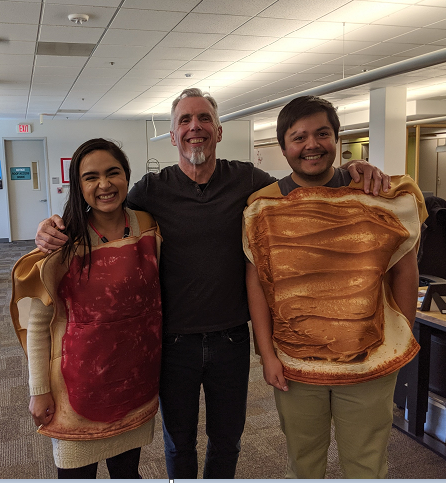 Veronica and coworkers in Halloween costumes.