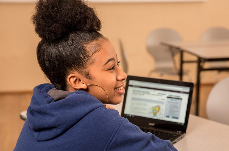 Female student using CommonLit