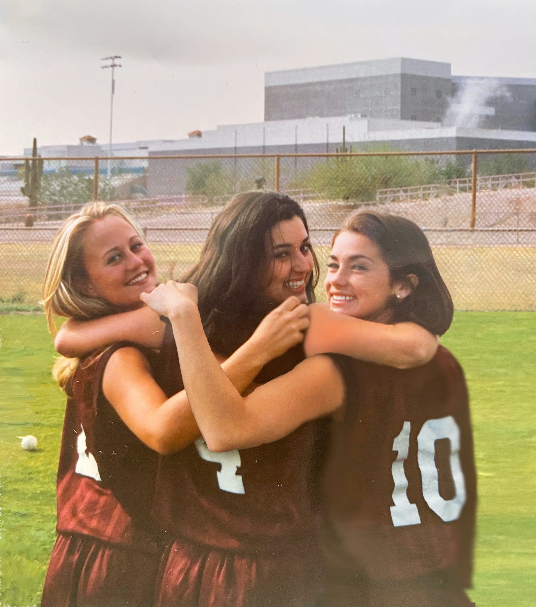 Kristen and her two friends on their old softball team. 