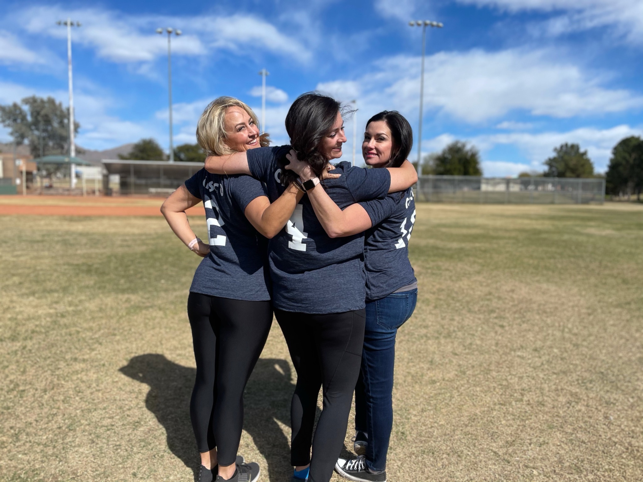 Kristen and friends on the Cisco softball team.