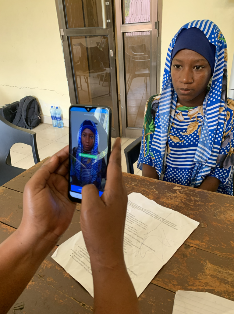 A woman being identified through facial recognition