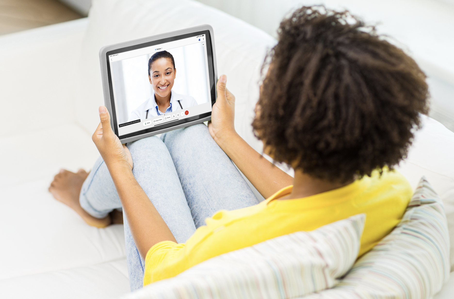 Woman using device for virtual care visit