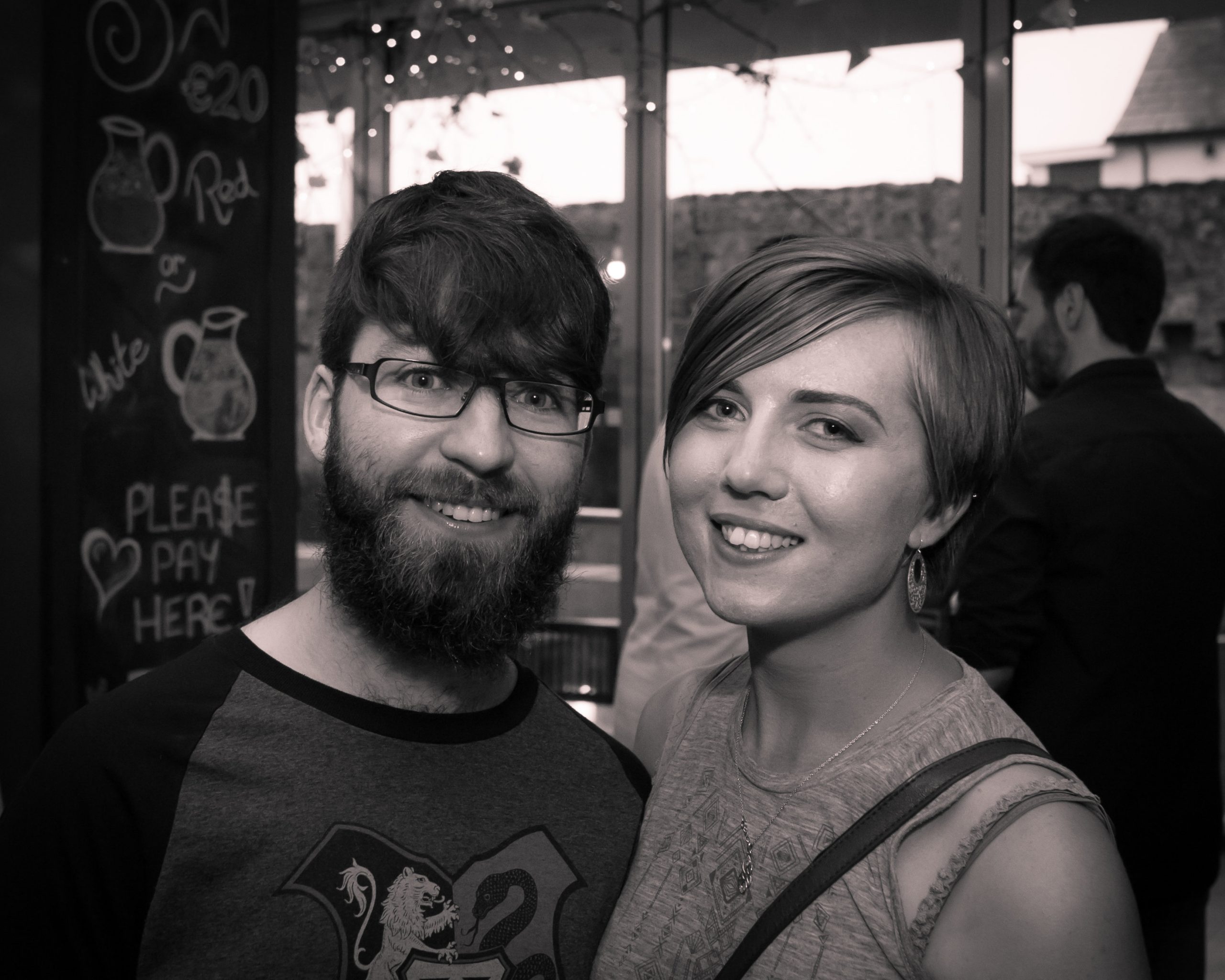 Sara and boyfriend out at a bar. 