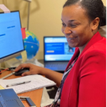 A woman sitting at an office desk