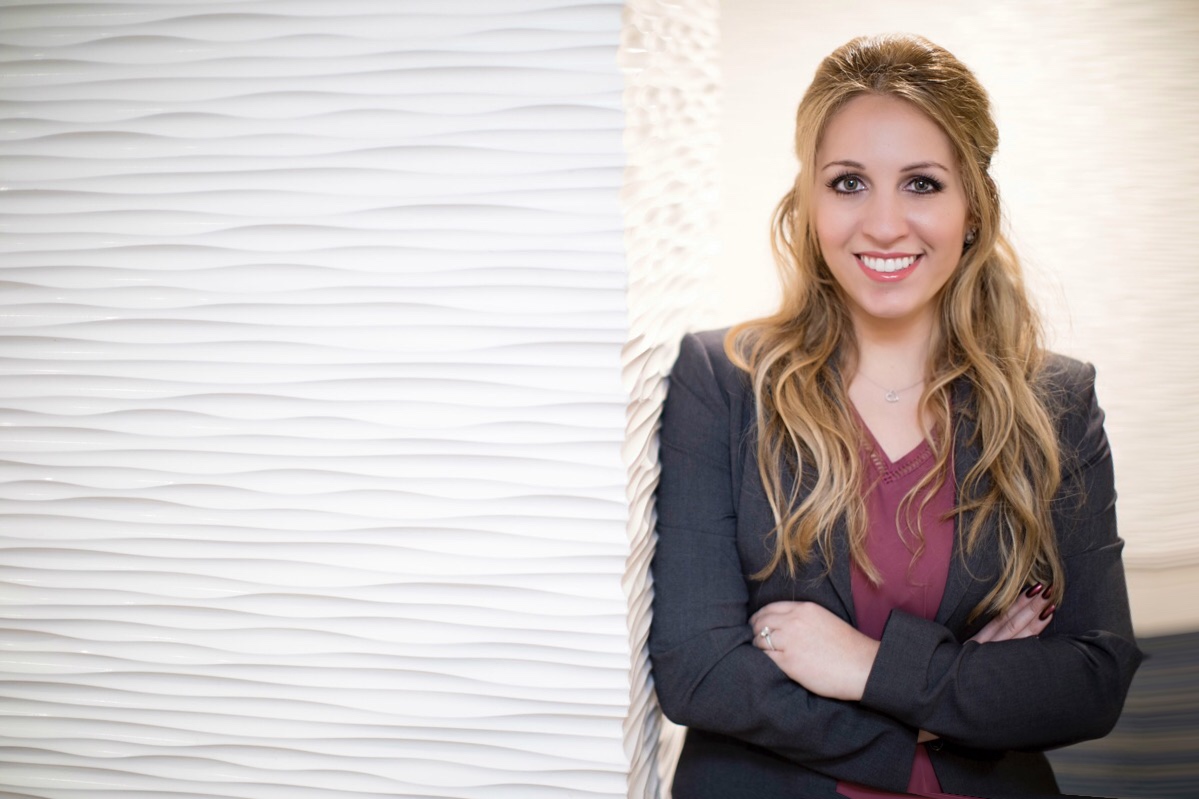 Samanthat posing in a suit jacket.