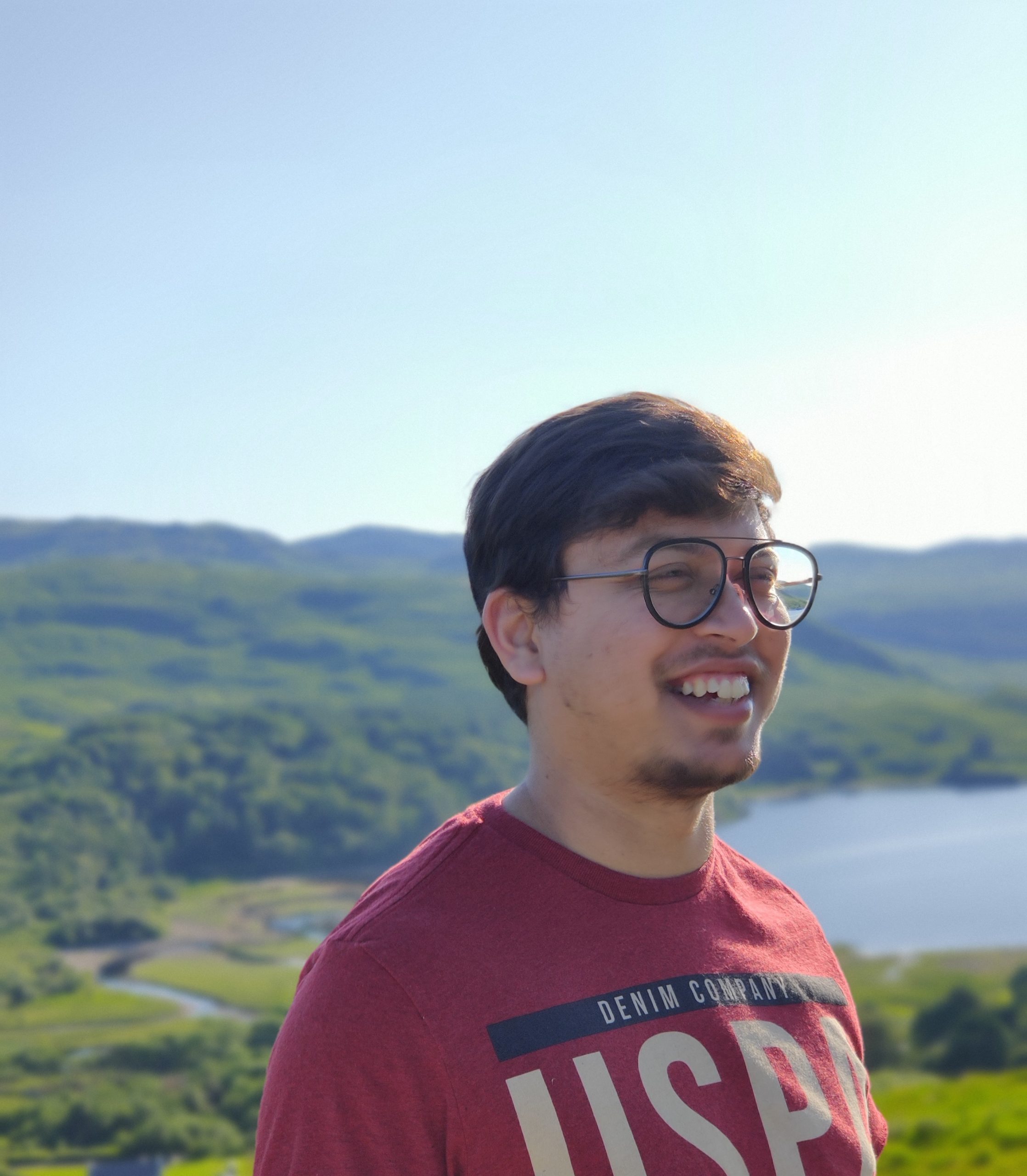 Apurv posing in front of lake. 