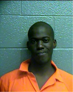 A man wearing an orange jumpsuit