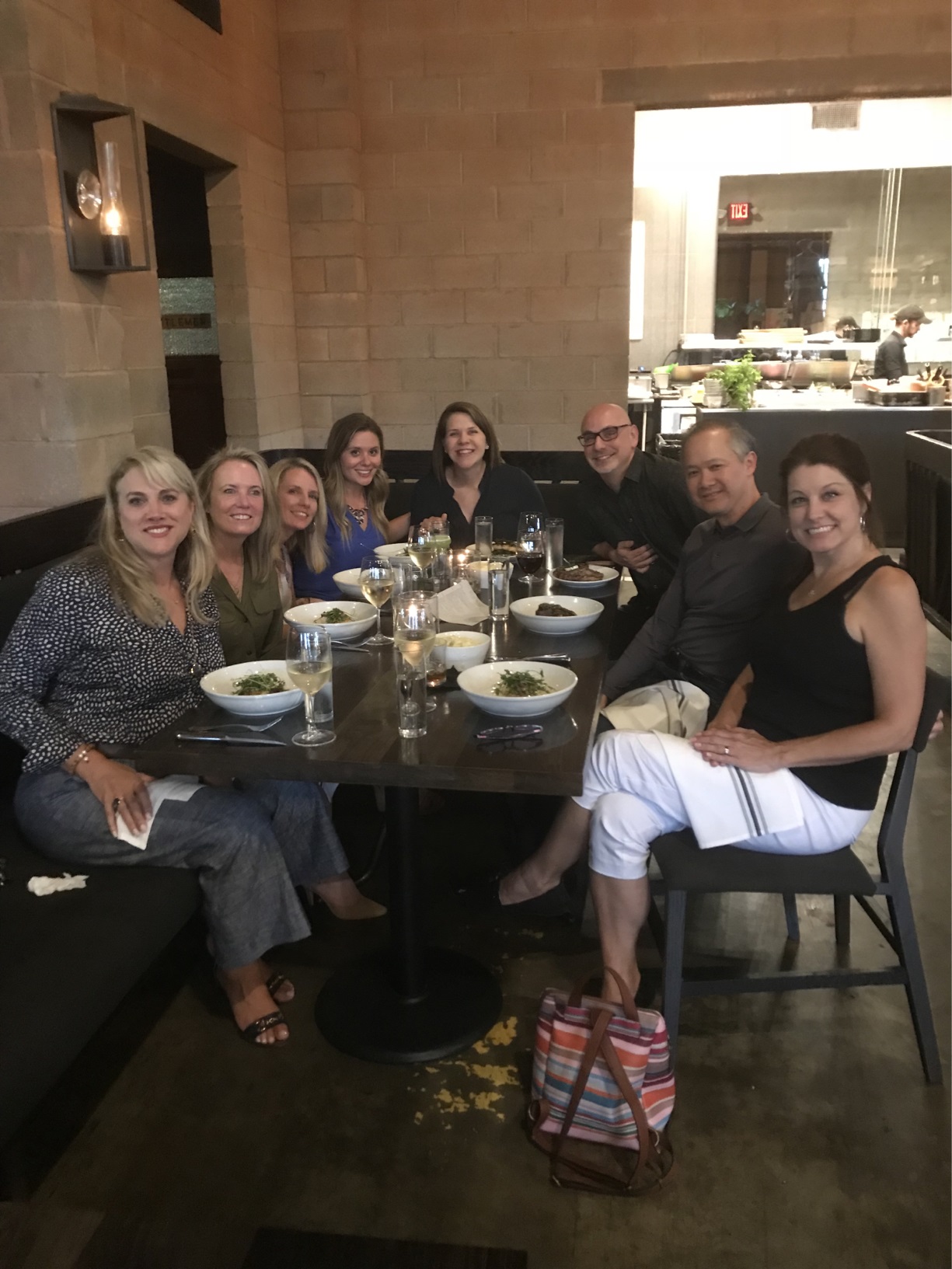 Audrey eating dinner with co workers.