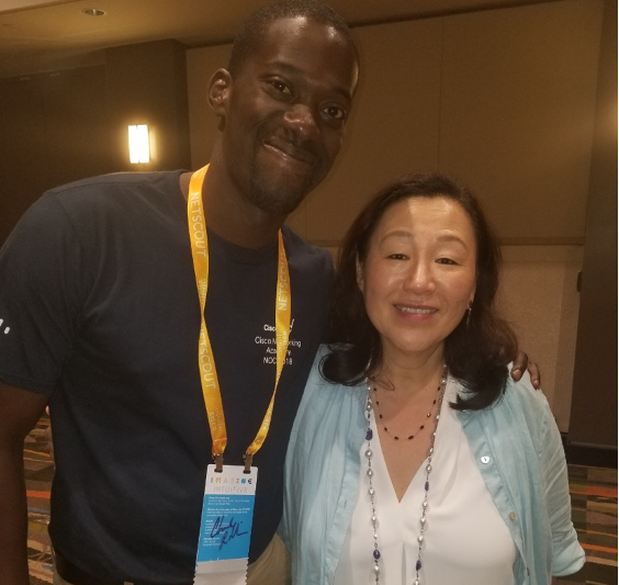 A man and a woman pose together for a photo