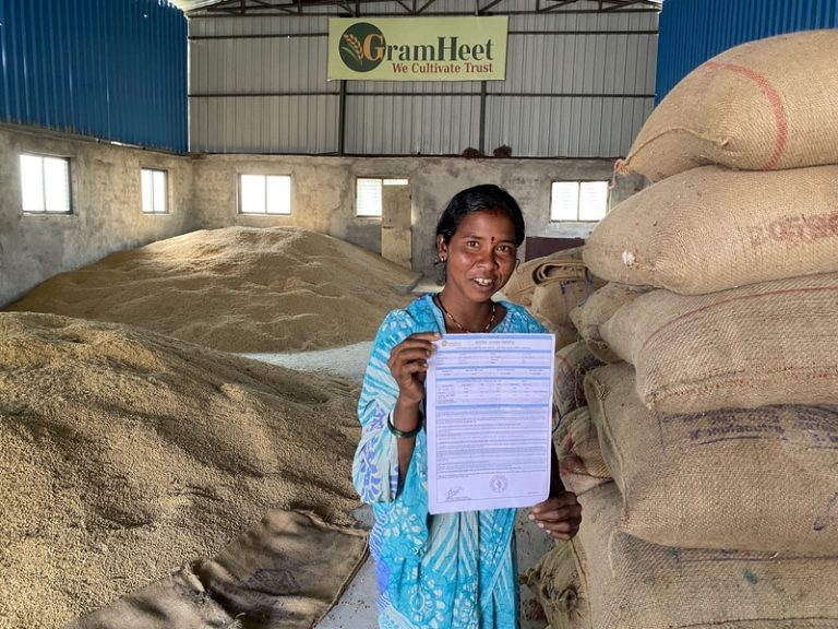 A farmer standing in farming warehouse