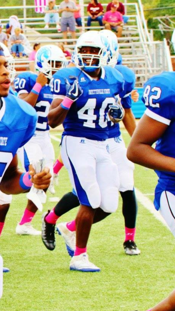 Kirkland McKenzie on the field playing football.