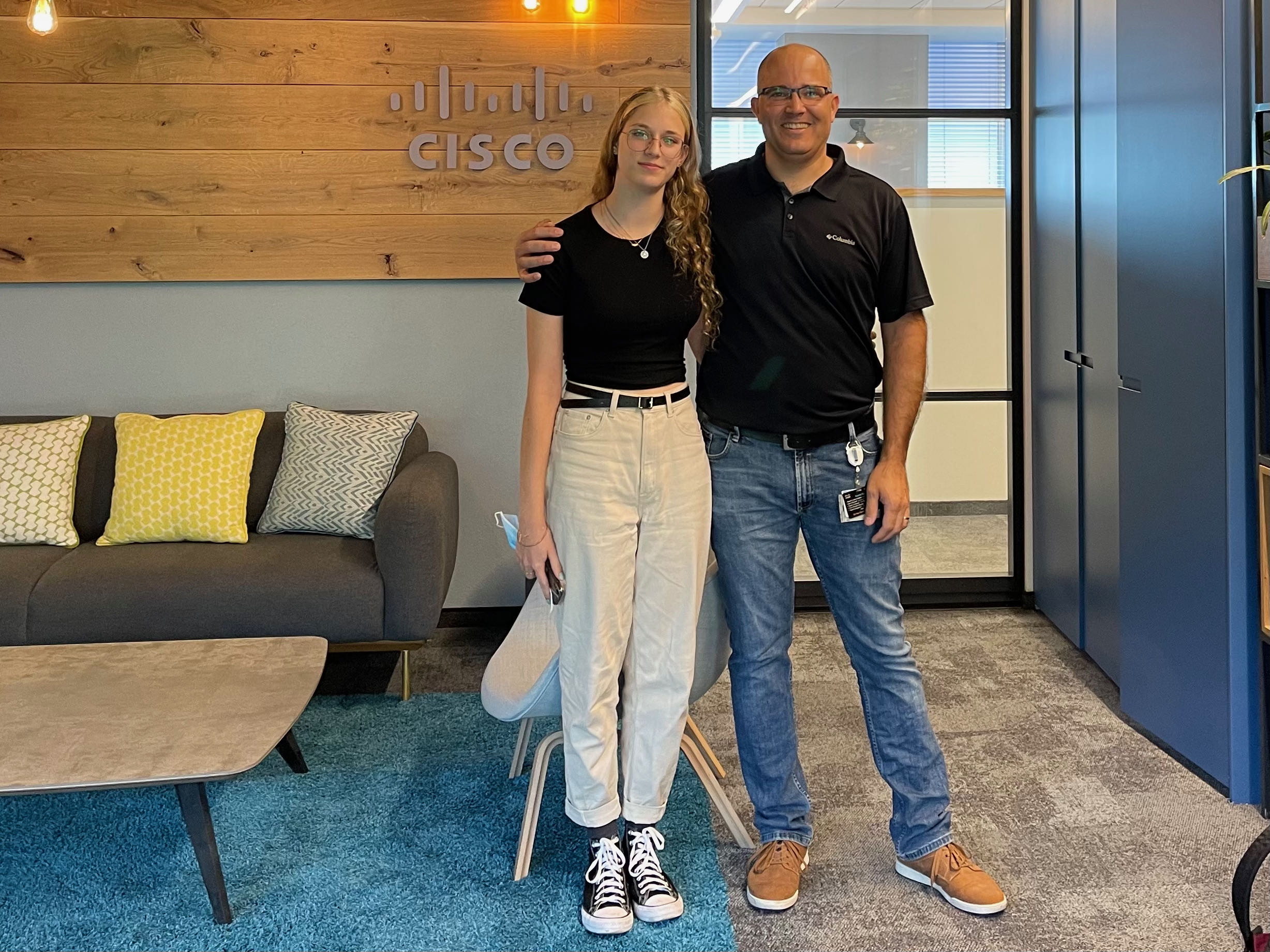 Tal and his daughter in the Cisco office.