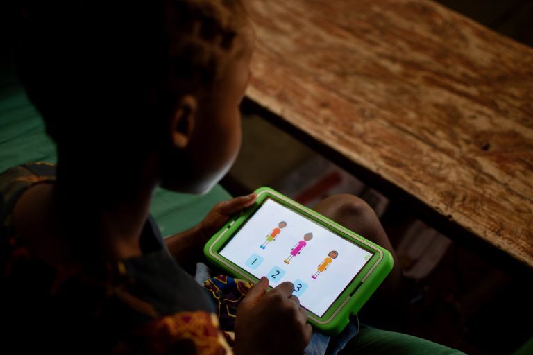 A child learning on a tablet