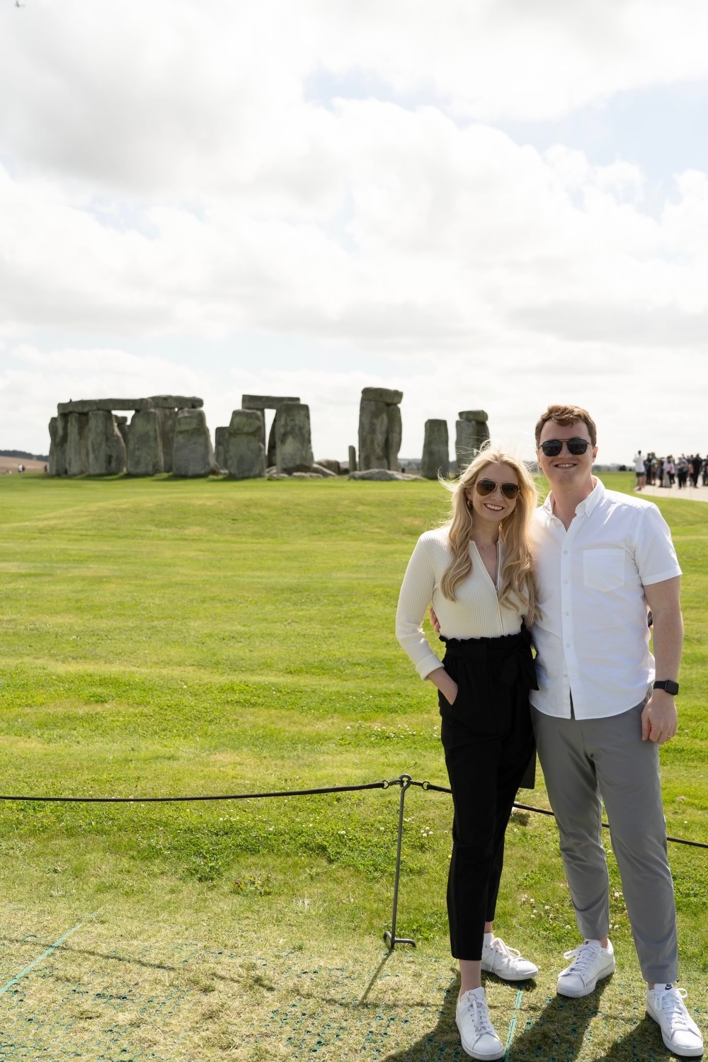 Madison and her husband stand outside Stonehenge.