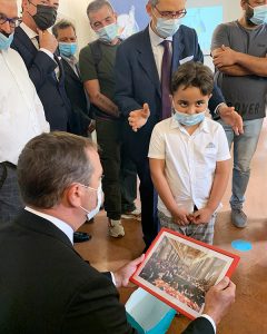 A young boy with the CEO of Cisco