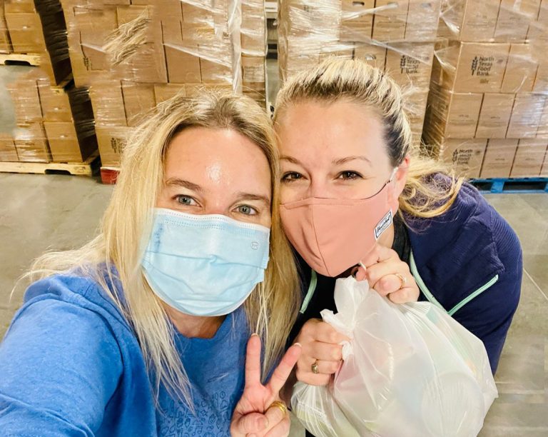 Jamelyn (on right) and LucianaPowell, a fellow AppD employee, wearing covid masks while volunteering at the North Texas Food Bank during pandemic